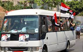Lebanese scuffle with Syrians voting abroad in support of Assad | Reuters